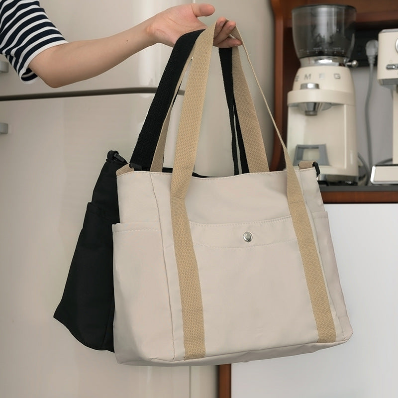 Luvéra Stilvolle Tasche mit hoher Kapazität, die von Hand getragen oder als Umhängetasche getragen werden kann